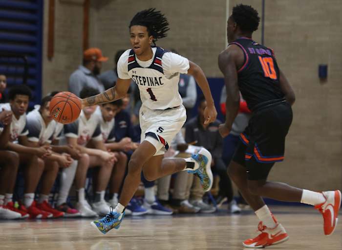 Stepinac's Boogie Fland (1) drives to the basket against Saint Raymond during boys basketball action at Stepinac High School in White Plains Jan. 20, 2023. Stepinac won the game 89-87. Fland finished the game with 40 points.